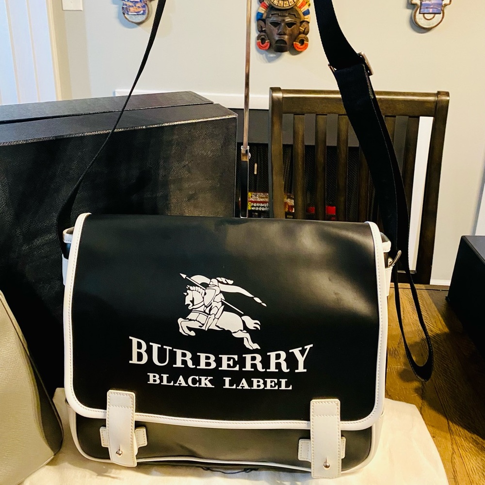 Burberry messenger bag in black & white color.